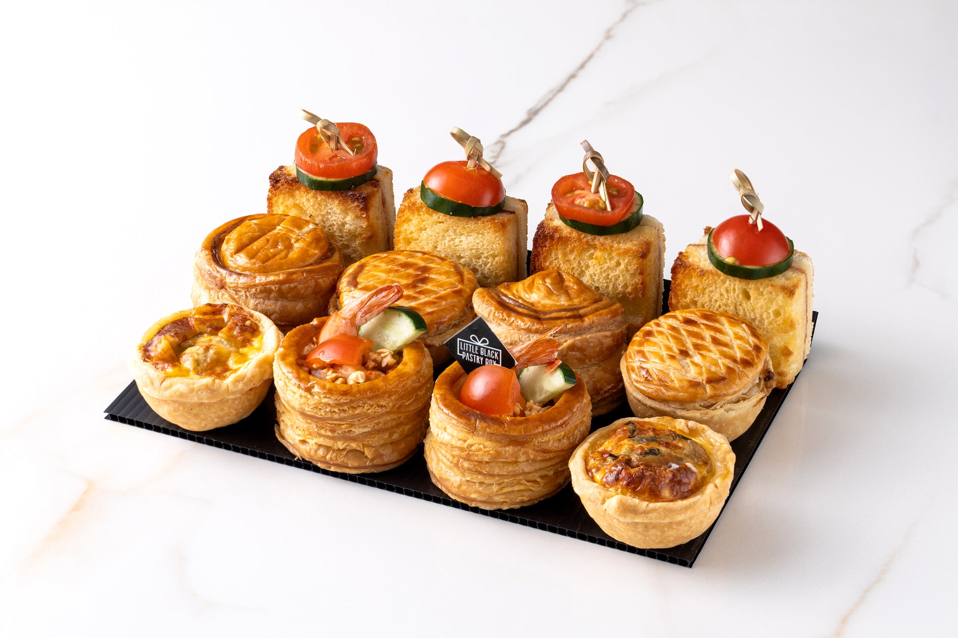 Le Goûter salé pronounced as gou-teh sa-leh is our latest savory box. We hear you well, you need a savory box to complete your Hi Tea set! Here you go, in the box :&nbsp;

Thermidor vol-au-vent 2pcs:
Puff pastry with thermidor butter &amp; prawns

Quiche 2pcs:
Mushroom &amp; spinach&nbsp;

Croque Monsieur 4pcs:
baked sandwich with turkey ham &amp; cheese

Salmon Puff 2pcs:
Puff pastry with salmon mousse &amp; smoked salmon

Mini pie 2pcs:
Creamy chicken &amp; mushroom